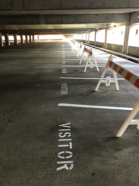 Striped new visitor spaces at the Infinity insurance parking garage. 